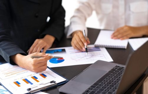 Business,Adviser,Analyzes,Financial,Figures,By,Checking,Documents.,Marketing,Plan